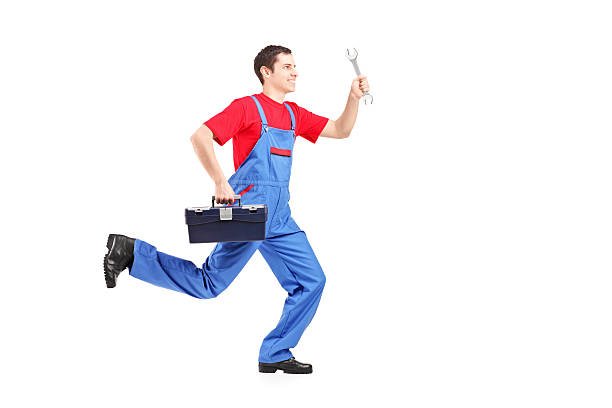 istock Repairman running with a wrench and tool box 176713558
