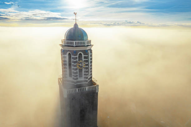 istock Peperbus church tower in Zwolle above the mist 1767149461