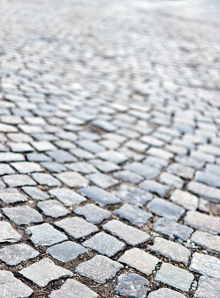istock cobble road Stone sidewalk as background 176715269