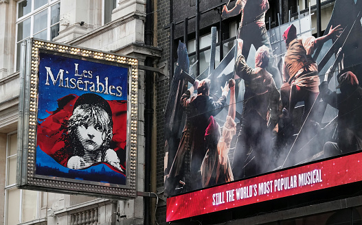 London, UK - March 15, 2023: Promotional sign for Les Miserables musical show outside the Sondheim Theatre, London, UK.