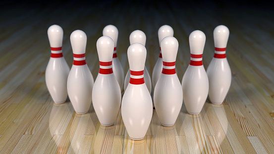 Aligned Bowling Pins and Wood Floor