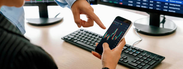 istock Businessman analysis stock graph displayed in mobile phone. Closeup. Burgeoning. 1767166379
