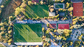 Aerial view of Empty Green football pitch and Public Ground