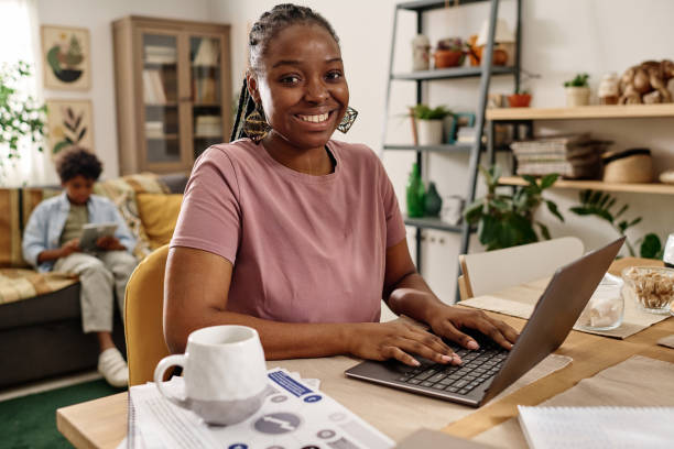 istock Black Woman Working on Laptop at Home 1767190771