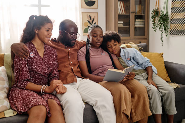 istock Hugging Black Family Reading 1767191283