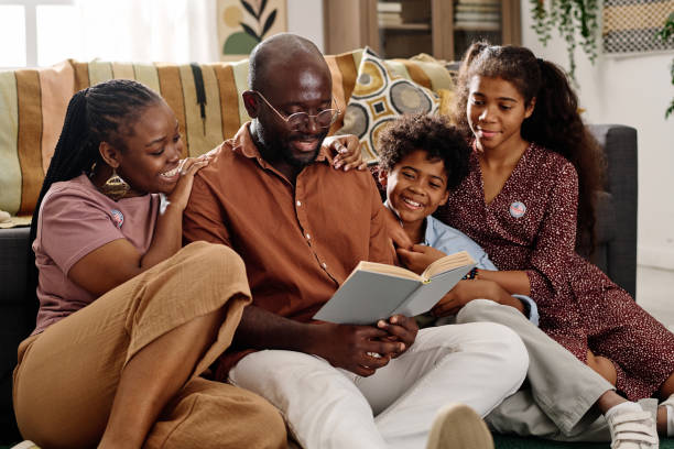 istock Father of Family Reading Book 1767191288