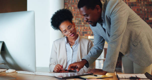 istock Business people, teamwork and planning with documents, finance report and budget proposal for startup project. Professional woman and manager talking, collaboration or review of audit in night office 1767192962
