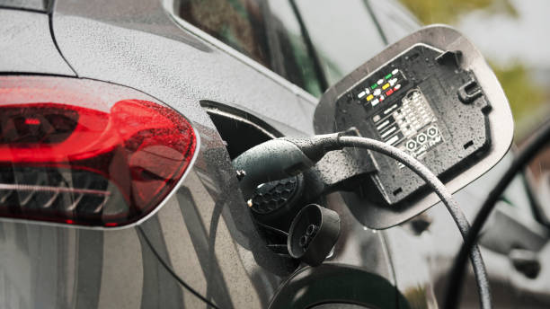 istock Electric car is connected to the charging station - it is raining 1767194700