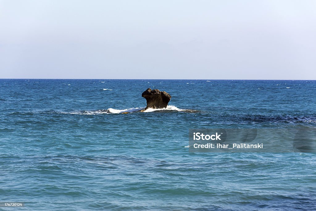 Sea shore and a lone rock. Sea shore and a lone rock. Paphos, birthplace of Aphrodite. Cyprus. Aphrodite - Greek Goddess Stock Photo