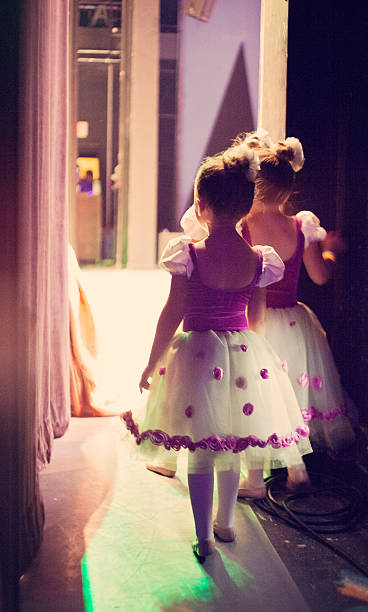 ballet backstage little ballerinas getting ready for performance dark pink dress stock pictures, royalty-free photos & images