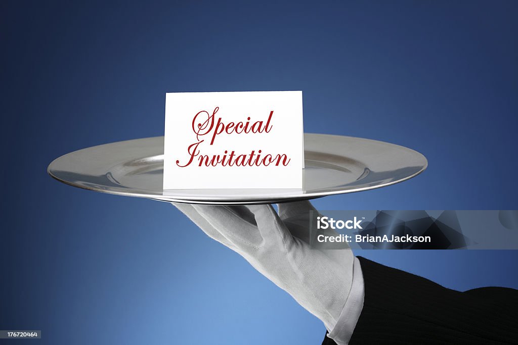 Formal invitation Butler or waiter holding a card reading special invitation on a silver platter- message can easily be changed Tray Stock Photo