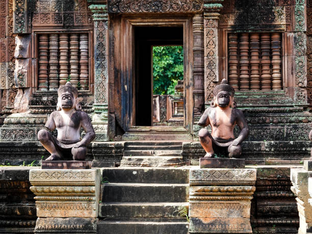 Ancient carvings at temple ruins in Ta Phrom Angkor Cambodia