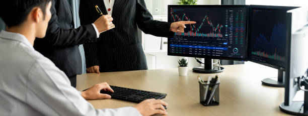 istock Group of profession trader discuss while point the financial graph. Burgeoning. 1767209477