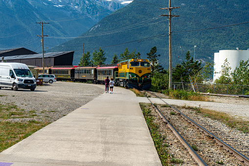 Skagway, Alaska - Aug. 5, 2023: Tourists are walking back to cruise. Skagway townscape in the morning, Alaska, USA.
