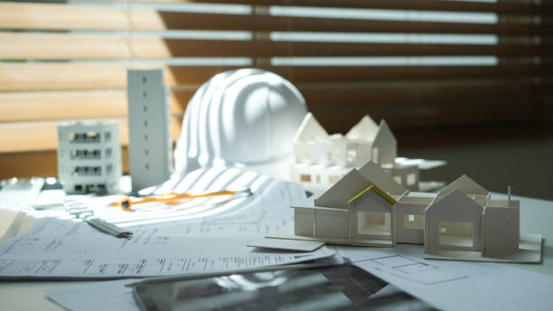 istock Architectural, contractors, tablet designers, sketches, blueprints and construction workspace for architectural buildings. 1767227180