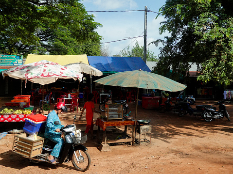 Rural countryside, Siem Reap, Cambodia- September 7, 2018: Small rural roadside shops and shoppers, Cambodia.