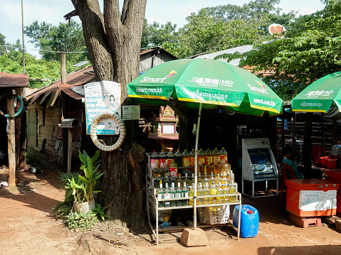 Rural countryside, Siem Reap, Cambodia- September 7, 2018: Small rural roadside shops and shoppers, Cambodia.