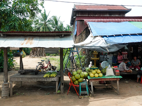 Rural countryside, Siem Reap, Cambodia- September 7, 2018: Small rural roadside shops and shoppers, Cambodia.