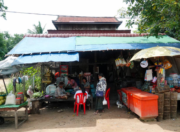 Rural countryside, Siem Reap, Cambodia- September 7, 2018: Small rural roadside shops and shoppers, Cambodia.