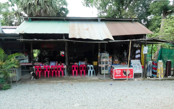 Rural countryside, Siem Reap, Cambodia- September 7, 2018: Small rural roadside shops and shoppers, Cambodia.