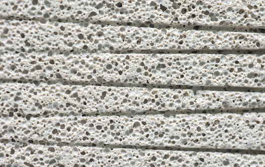 Texture and porosity of white concrete surface