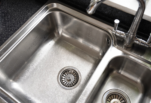 Simple view from above of an empty kitchen sink in a typical house.