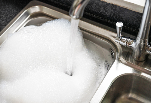 Washing up bubbles in kitchen sink