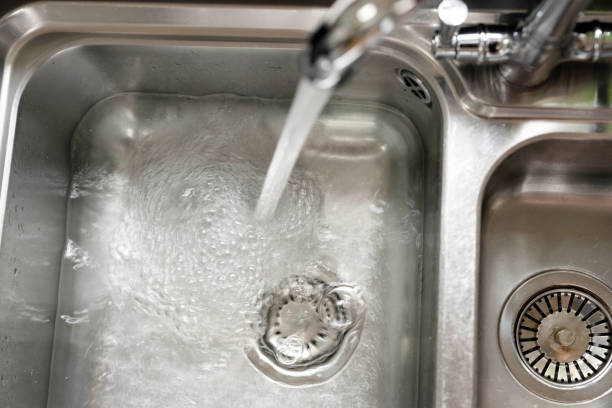Filling a kitchen sink with clean water