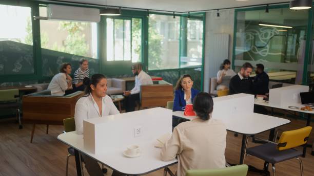 istock Multi-ethnic diverse group of business people working in global modern co-working office space 1767244726