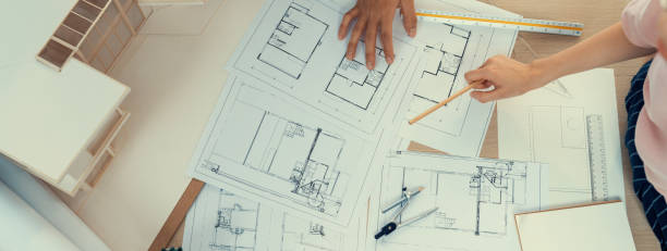 istock Blueprint architectural document scatter around on meeting table. Burgeoning. 1767244765