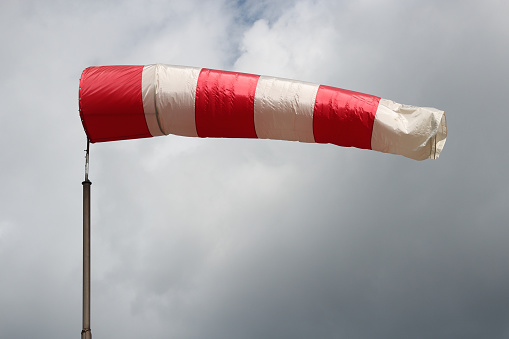 windsock against cloudy sky