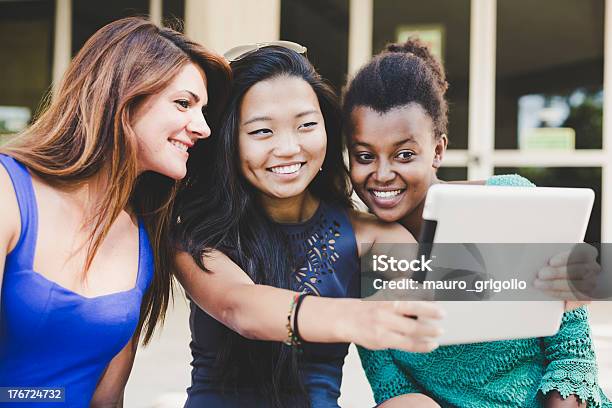 Three Young Women Taking Self Portrait With Digital Tablet Stock Photo - Download Image Now