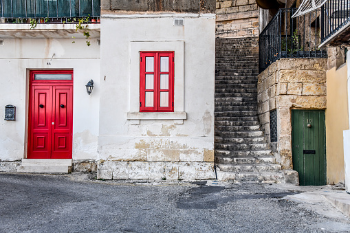 Red Door And Window To Urban Building In Valletta, Malta