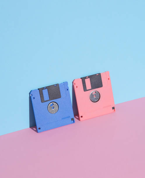 istock Pink and blue Floppy disks on pastel background. Retro 80s. Outdated technology. Creative layout, minimalism, trendy minimal still life 1767256349