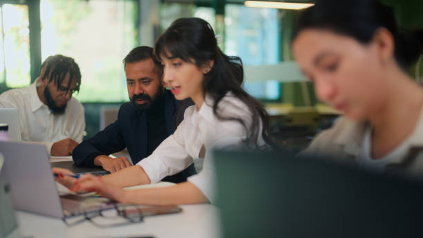 istock Group of multi-ethnic diverse business people working together in modern co-working office space 1767256381