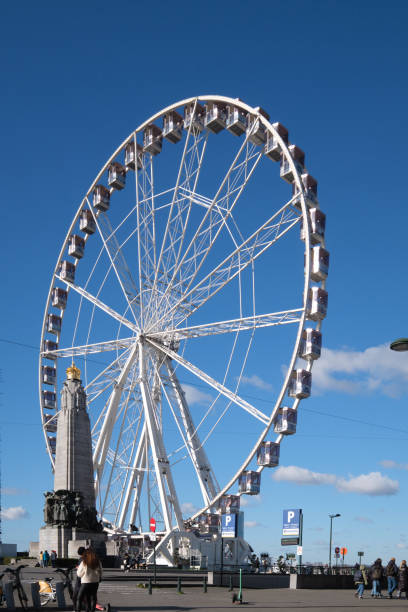 Brussels, Belgium - February 26, 2023: A large ferris wheel in city square.