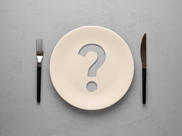 istock Ceramic plate with question mark over textured gray background. Dieting and nutrition concept. 1767278670