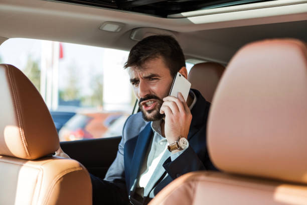 istock Young Businessman Utilizing Phone in Limousine 1767281449
