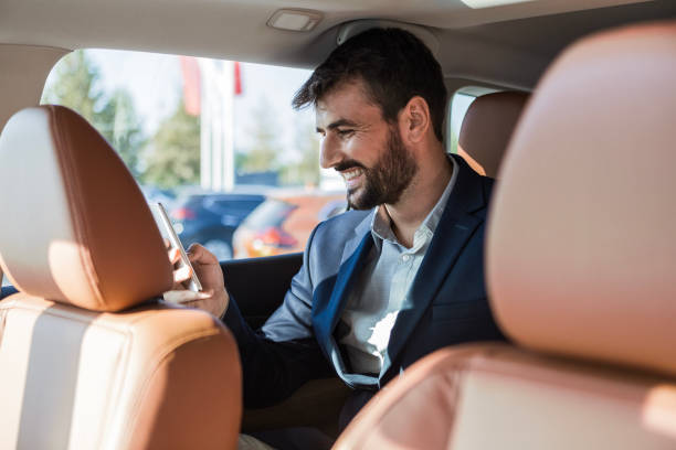 istock Young Businessman Engaging on Phone in Limousine 1767281967