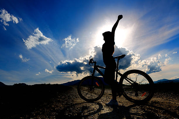 istock biker woman silhouette 176728255