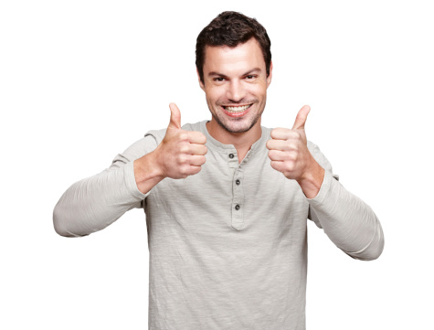 Portrait of a handsome young man giving you the thumbs up while isolated on white