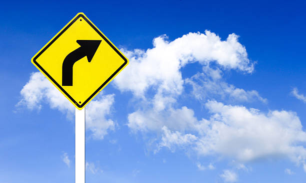 istock Curved Road Traffic Sign with blue sky 176728804