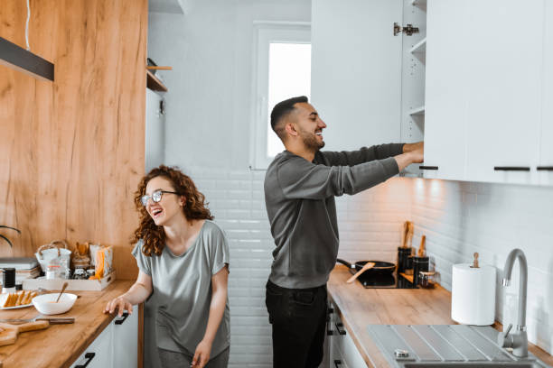 istock Fun Times For Cute Couple Cooking Together At Home 1767306621