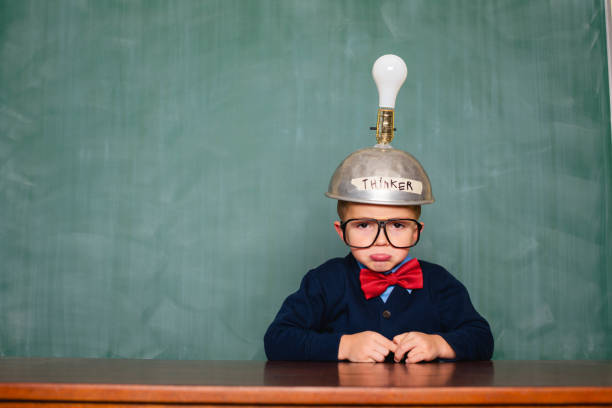 istock Young nerd boy with thinking cap and no ideas 1767318052
