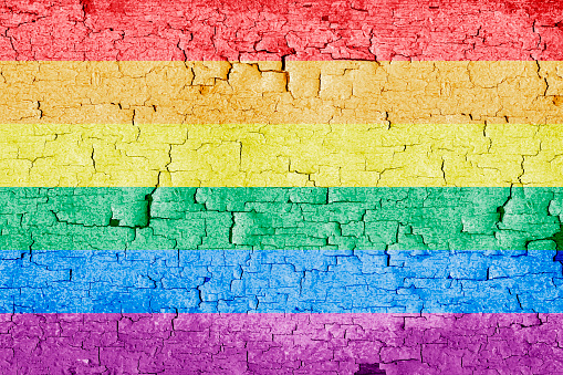 Pride flag with old wooden background