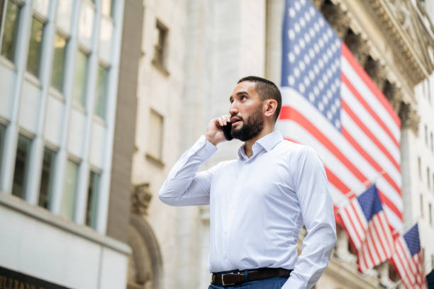 istock Manhattan financial advisor talking on phone outdoors 1767346704