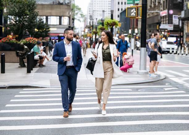 istock Work colleagues crossing street in Lower Manhattan 1767348800