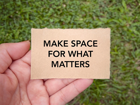 MAKE SPACE FOR WHAT MATTERS written on a paper. With blurred styled background.