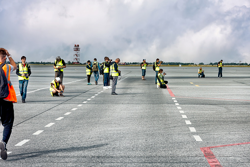 Photographers waiting for an aircraft landing at the airport: Abakan, Russia - August 08, 2020