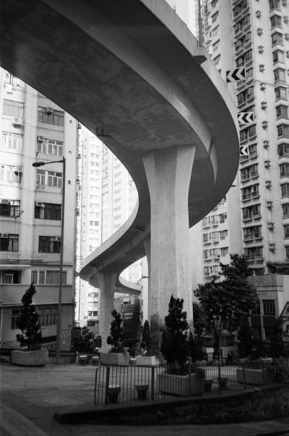 Hong Kong - December 20, 2020:  Sai Ying Pun high density residential living. The photo was captured in black and white mid morning. It emphasises brutalist architecture.